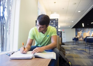 HPU student studying in Mabee Center for web