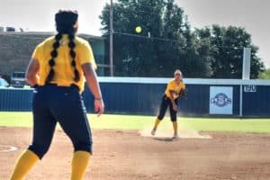 Softball player from Howard Payne University preparing to catch a ball during an outdoor game. | HPU