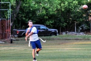 Man playing flag football at Howard Payne University prepares to catch a pass outdoors. | HPU