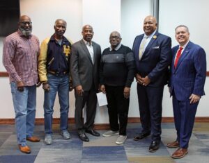 Participants in HPU’s recent Black History Luncheon stand in a row, from left, Tim Whetstone, Rev. L.J. Clayton Jr., Gary Hopkins, Wilbert Rogers, Robert Morrison and Dr. Cory Hines.
