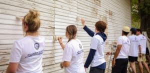 Students paint building for service day
