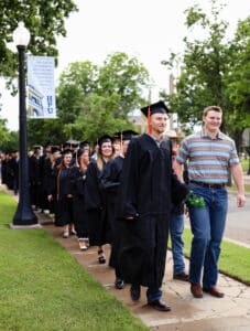 Graduating seniors, accompanied by underclassmen, participate in HPU’s annual Chime Out ceremony.