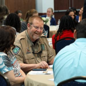 Scott McIntosh, guest speaker at HPU’s restorative justice seminar, talks with students.
