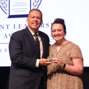 HPU student Emily Hughitt receives the Howard Payne University Servant Leadership Award, presented by Dr. Cory Hines, HPU president.