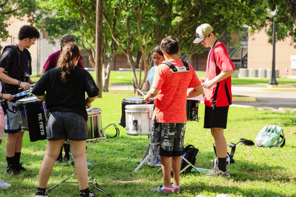 Students rehearse in a percussion breakout group.
