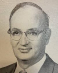 Vintage portrait of a Howard Payne University man wearing glasses. | HPU